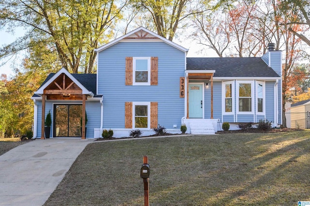 view of front of house with a front yard and a carport