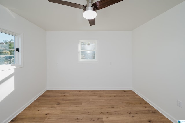 spare room featuring ceiling fan and light wood-type flooring