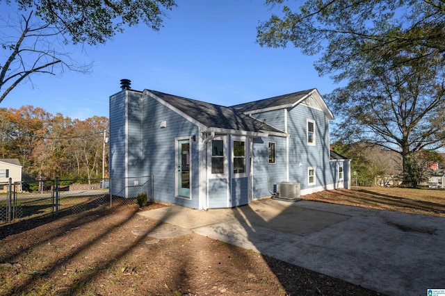 exterior space with central AC and a patio area