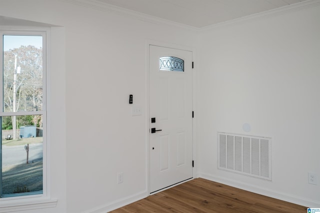 entrance foyer featuring wood-type flooring and ornamental molding