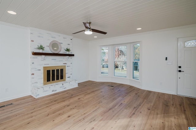 unfurnished living room with ceiling fan, ornamental molding, and light hardwood / wood-style flooring