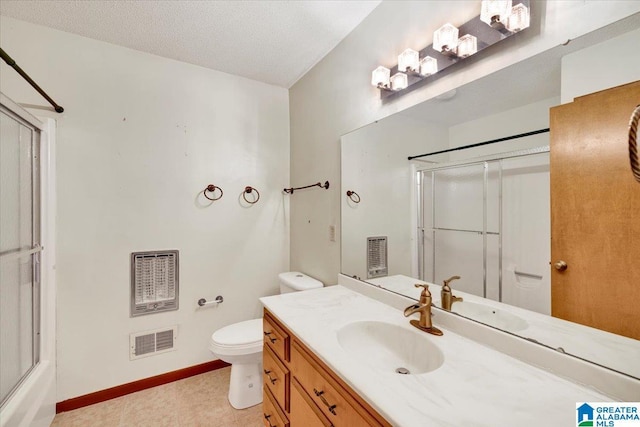 full bathroom featuring shower / bath combination with glass door, vanity, a textured ceiling, and toilet