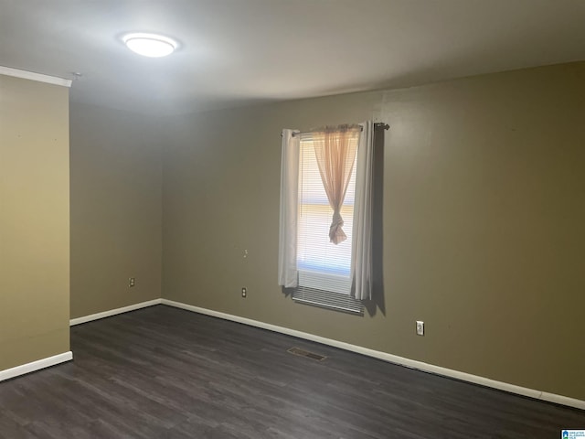 empty room featuring dark hardwood / wood-style flooring