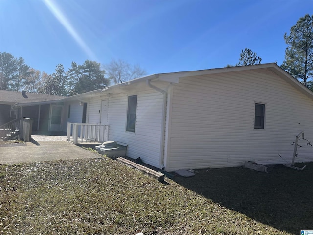 view of side of property with a patio area