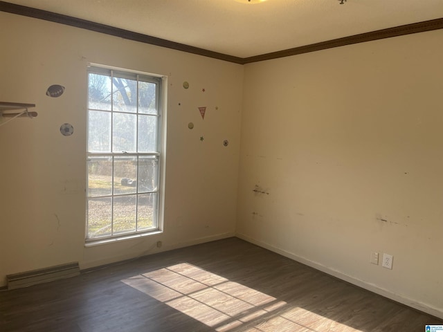 unfurnished room with crown molding, a healthy amount of sunlight, and light wood-type flooring