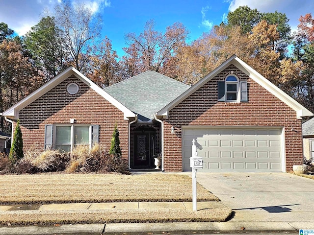 front facade featuring a front yard and a garage