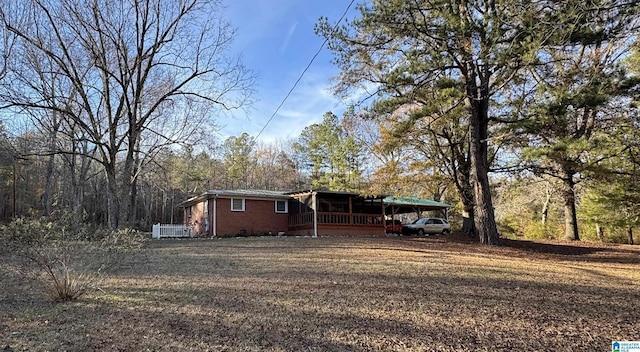 view of front of property featuring a carport