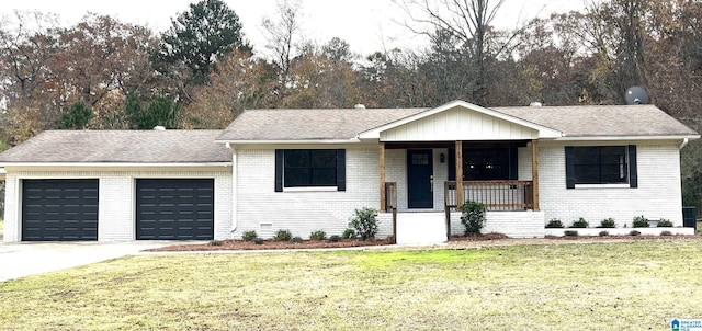 ranch-style house featuring a garage, covered porch, and a front lawn