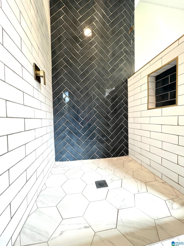 interior space with tiled shower