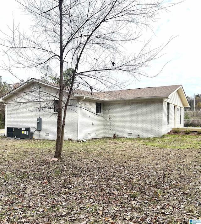 rear view of property featuring cooling unit