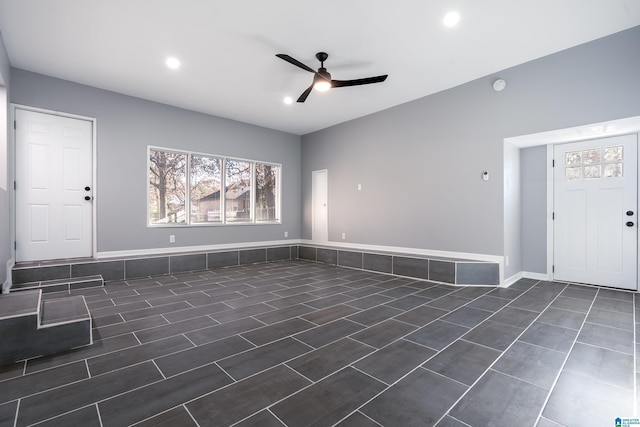 interior space with ceiling fan