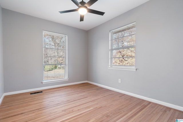 spare room with ceiling fan and light hardwood / wood-style flooring