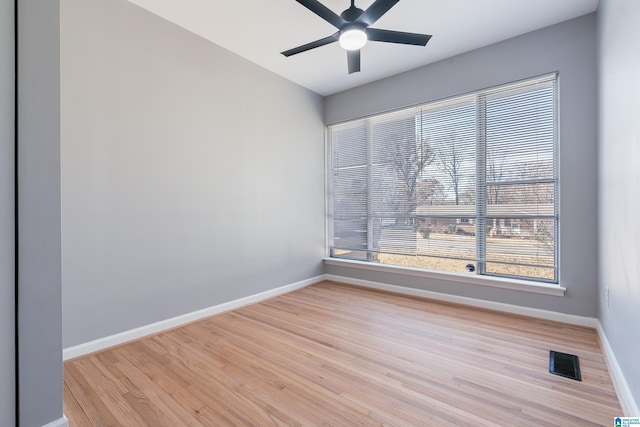 unfurnished room featuring ceiling fan and light wood-type flooring