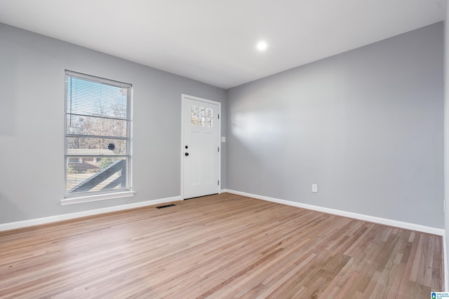 foyer entrance with light wood-type flooring