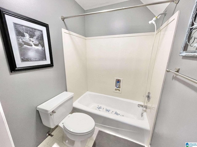 bathroom featuring tile patterned flooring, shower / bath combination, and toilet