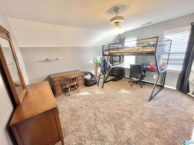 bedroom with multiple windows, ceiling fan, carpet, and vaulted ceiling