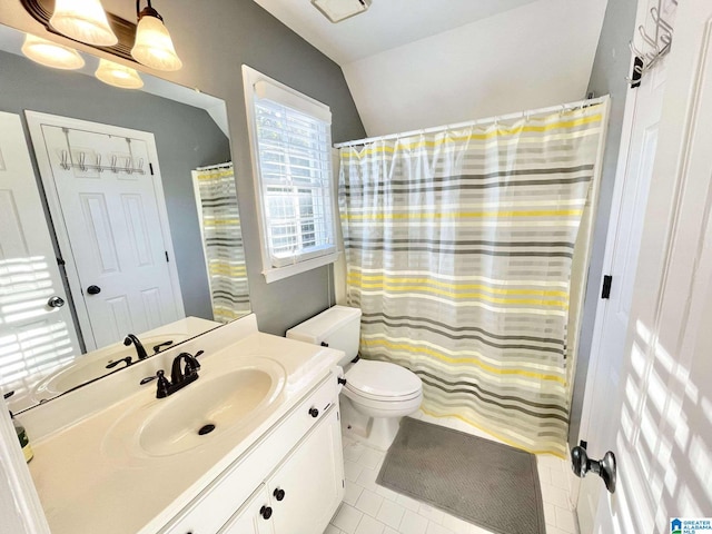 bathroom with a shower with curtain, tile patterned flooring, vanity, and toilet