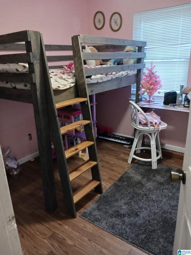 bedroom featuring dark hardwood / wood-style floors