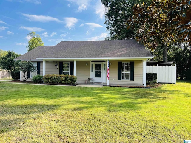 single story home with a front yard and covered porch