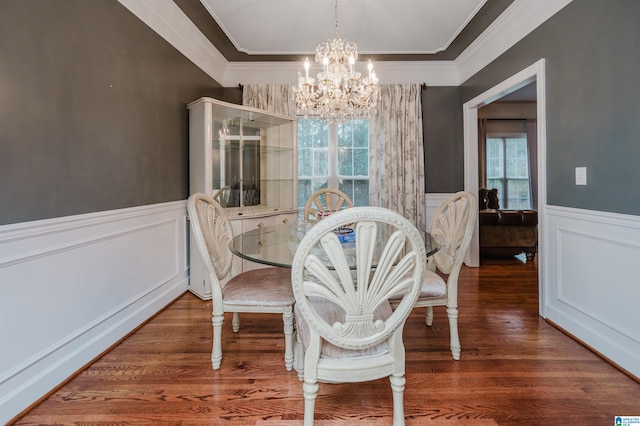 dining room featuring a wealth of natural light, dark hardwood / wood-style flooring, and a chandelier