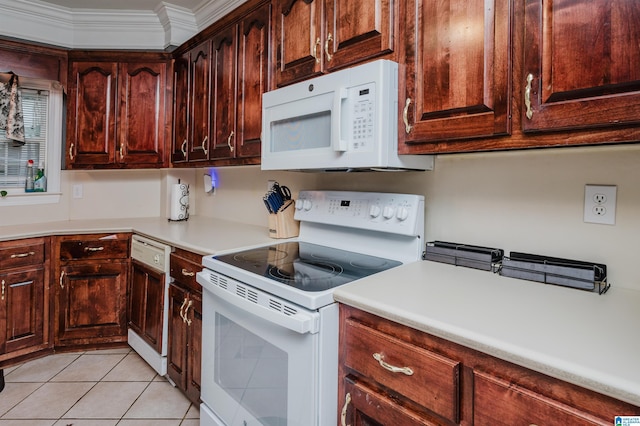 kitchen featuring light tile patterned floors, white appliances, and ornamental molding