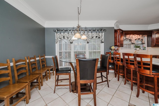 dining room featuring a chandelier, crown molding, and light tile patterned flooring