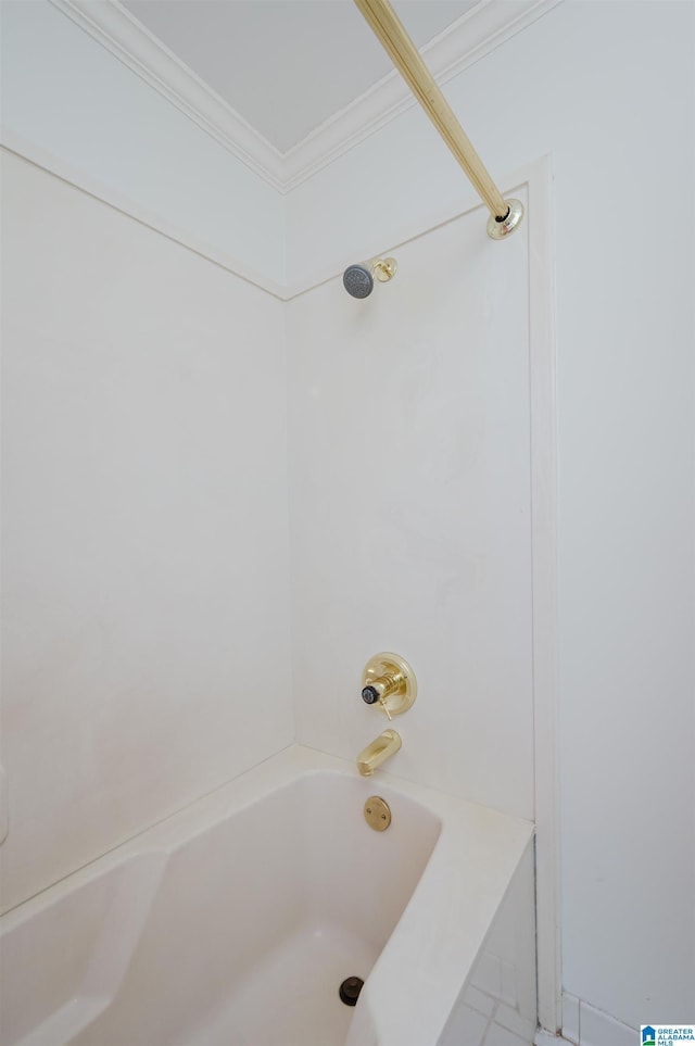 bathroom featuring shower / washtub combination and ornamental molding