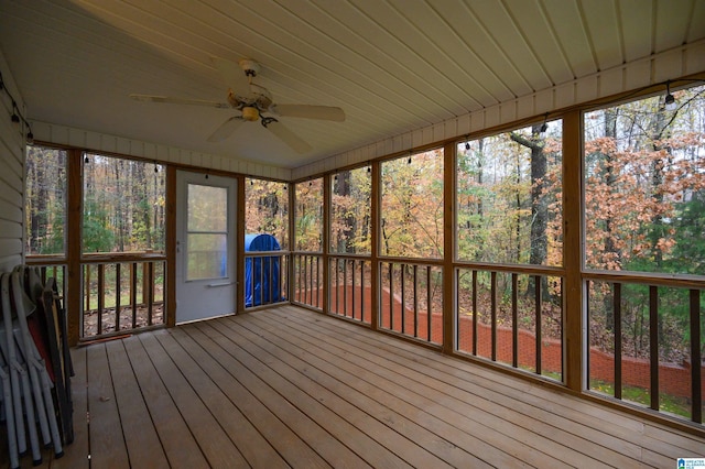 unfurnished sunroom with plenty of natural light and ceiling fan