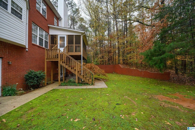 view of yard featuring a sunroom