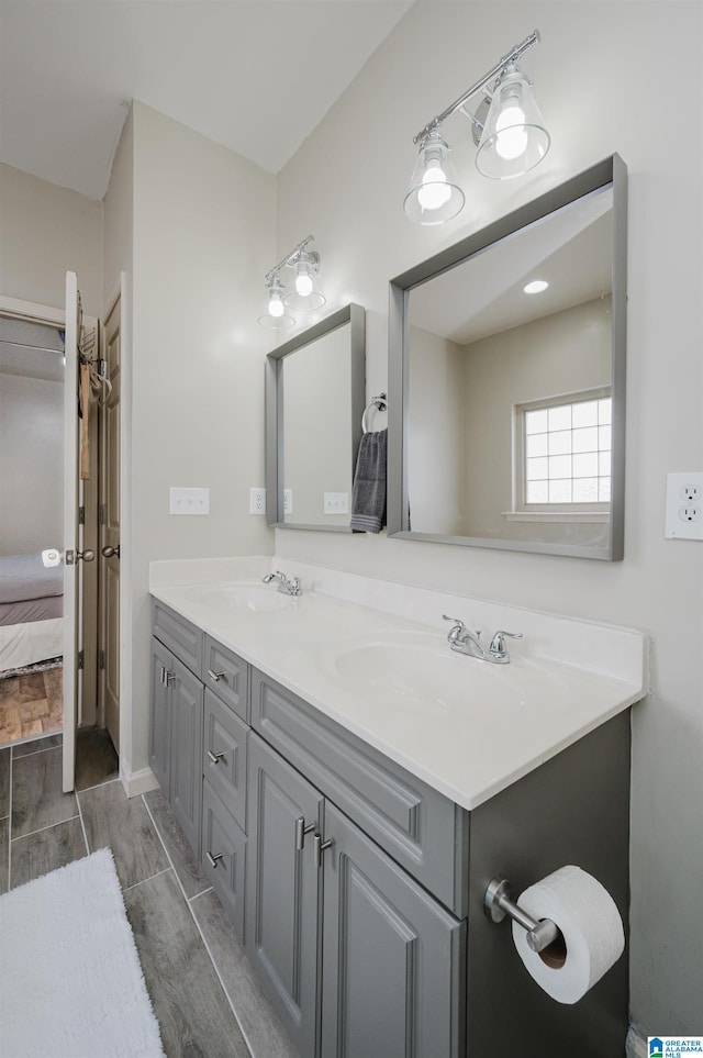 bathroom featuring hardwood / wood-style flooring and vanity