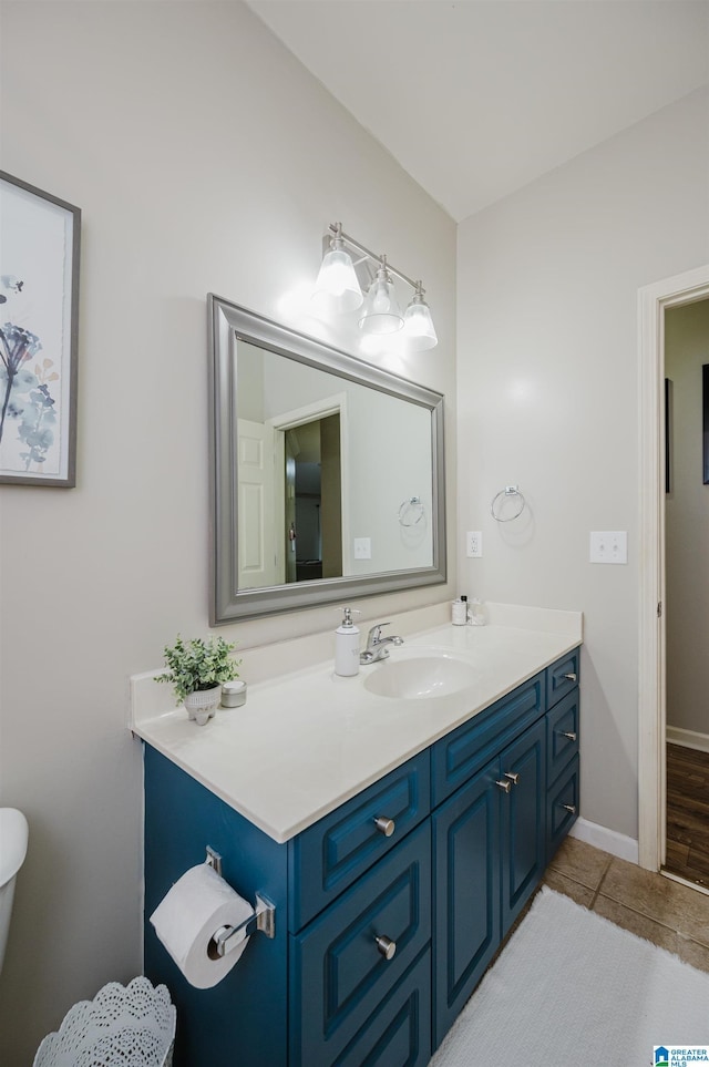 bathroom with tile patterned flooring and vanity