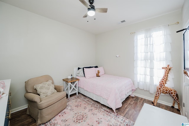 bedroom with hardwood / wood-style floors and ceiling fan