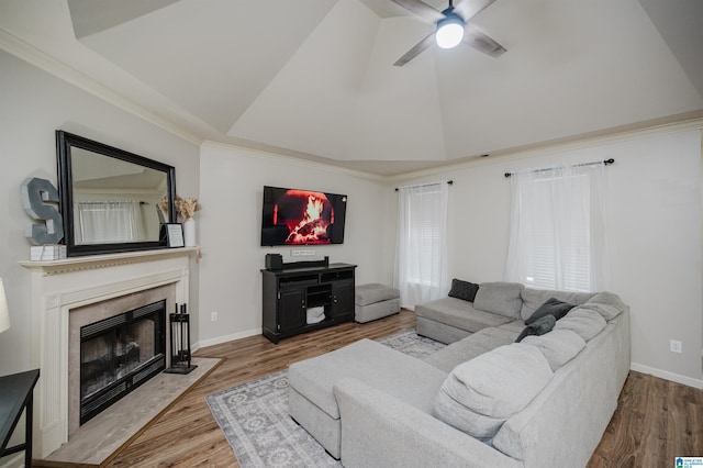 living room with ceiling fan, wood-type flooring, and crown molding