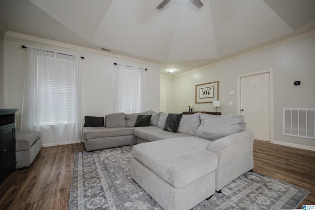 living room with ceiling fan, dark hardwood / wood-style flooring, crown molding, and vaulted ceiling