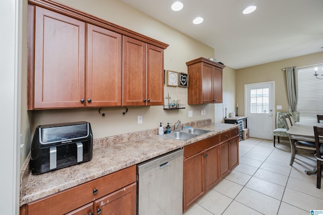 kitchen with dishwasher, light tile patterned flooring, and sink