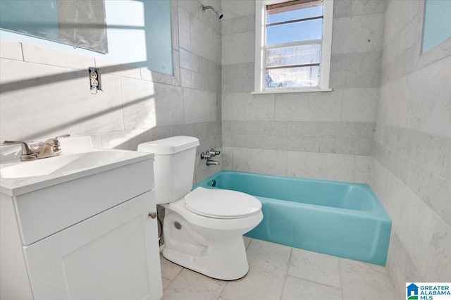 full bathroom featuring vanity, tiled shower / bath combo, tile walls, tile patterned flooring, and toilet