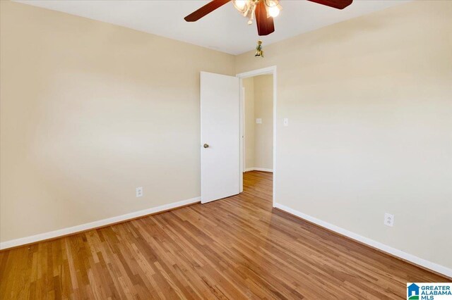 unfurnished room with hardwood / wood-style floors and ceiling fan