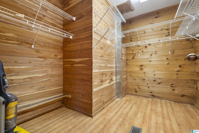 spacious closet with wood-type flooring