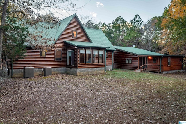 back of house featuring central AC