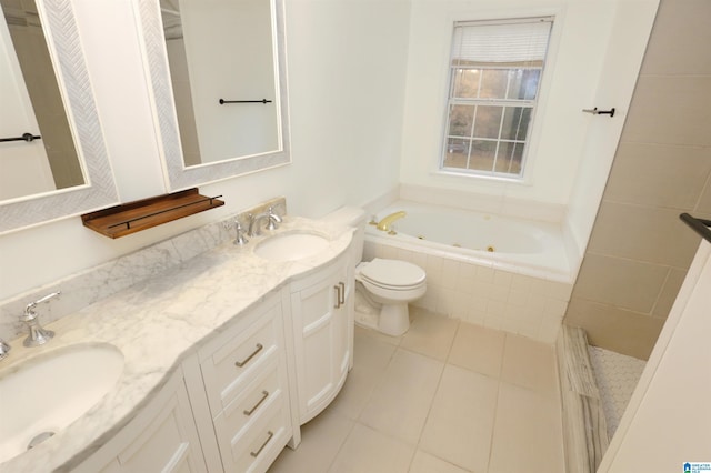 bathroom with tile patterned floors, tiled bath, vanity, and toilet