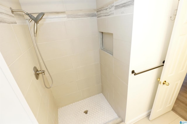 bathroom with tiled shower