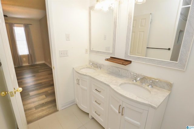 bathroom with hardwood / wood-style floors and vanity