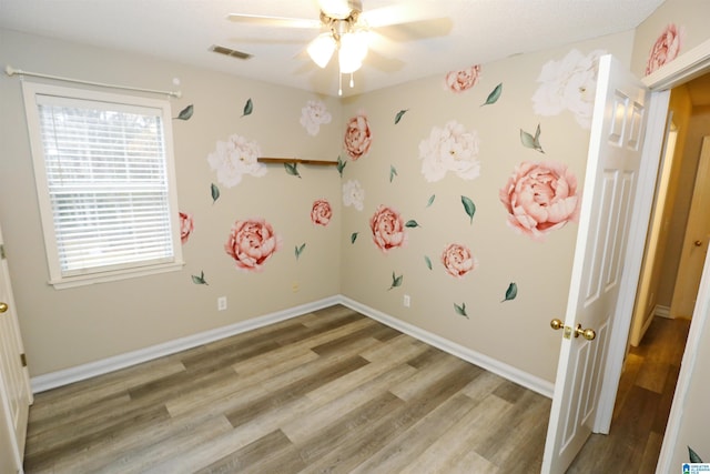 interior space featuring ceiling fan and hardwood / wood-style flooring