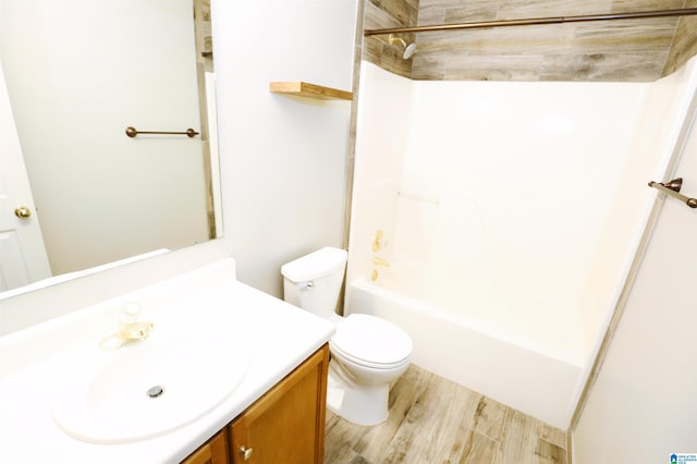 full bathroom featuring shower / bath combination, vanity, wood-type flooring, and toilet