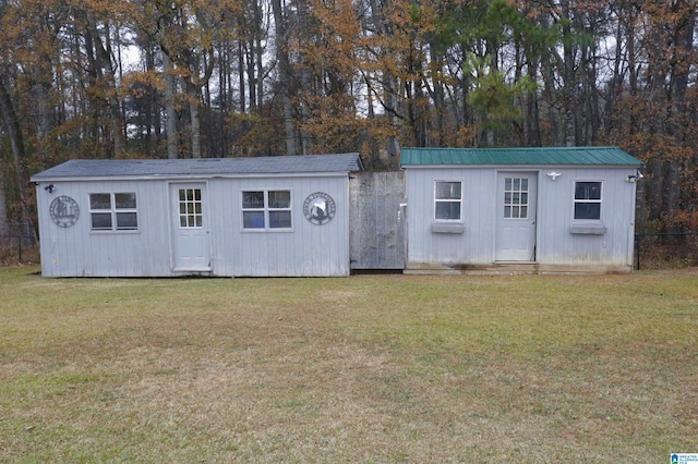 view of outbuilding with a lawn