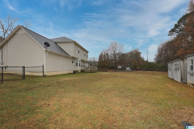 view of yard with a wooden deck