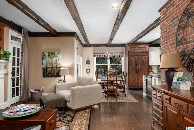 living room with beam ceiling, wine cooler, dark hardwood / wood-style floors, and a notable chandelier