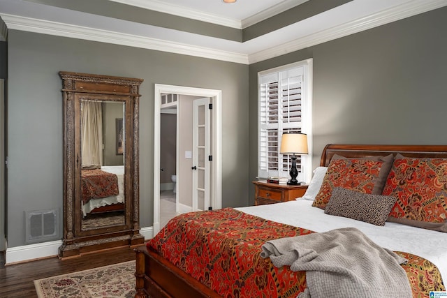 bedroom featuring ornamental molding and dark wood-type flooring