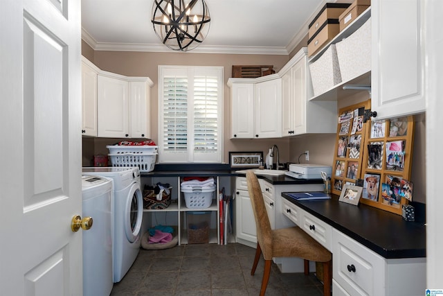 washroom featuring sink, an inviting chandelier, dark tile patterned floors, crown molding, and washer and clothes dryer