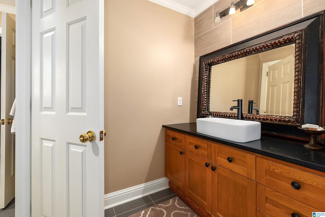 bathroom featuring tile patterned flooring, vanity, and ornamental molding